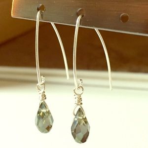 Sterling silver earrings with green glass bead